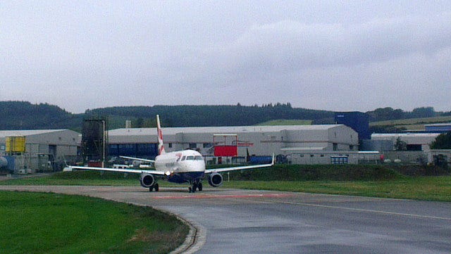 A plane awaits takeoff at Aberdeen airport A plane awaits takeoff at Aberdeen airport