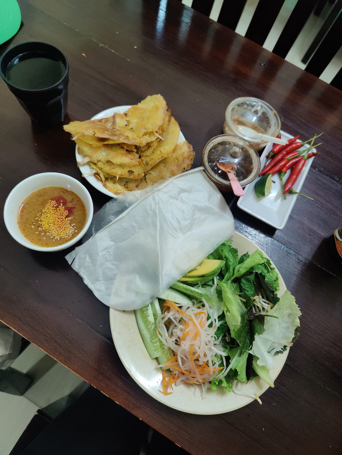 a table of Vietnamese pancake fixings a table of Vietnamese pancake fixings