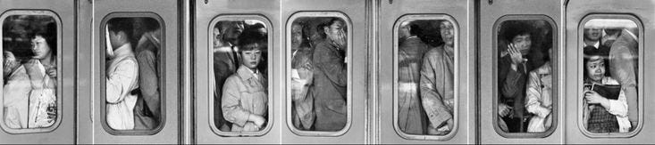 This may contain: several people are standing on the train doors