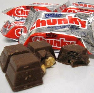 A chocolate bar with nuts in it
AI-generated content may be incorrect.