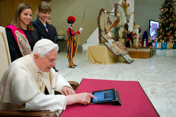 Pope Benedict XVI taps a tablet to send the first tweet from the papal account at his general audience in Paul VI Hall, Dec. 12, 2012 Pope Benedict XVI taps a tablet to send the first tweet from the papal account at his general audience in Paul VI Hall, Dec. 12, 2012