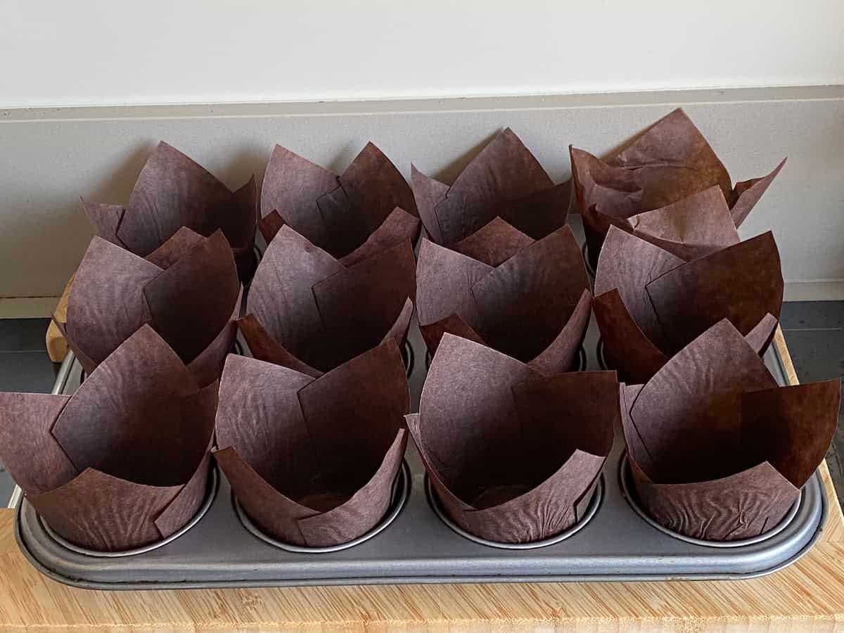 Tulip Paper Muffin Cases in a muffin tray. Tulip Paper Muffin Cases in a muffin tray.
