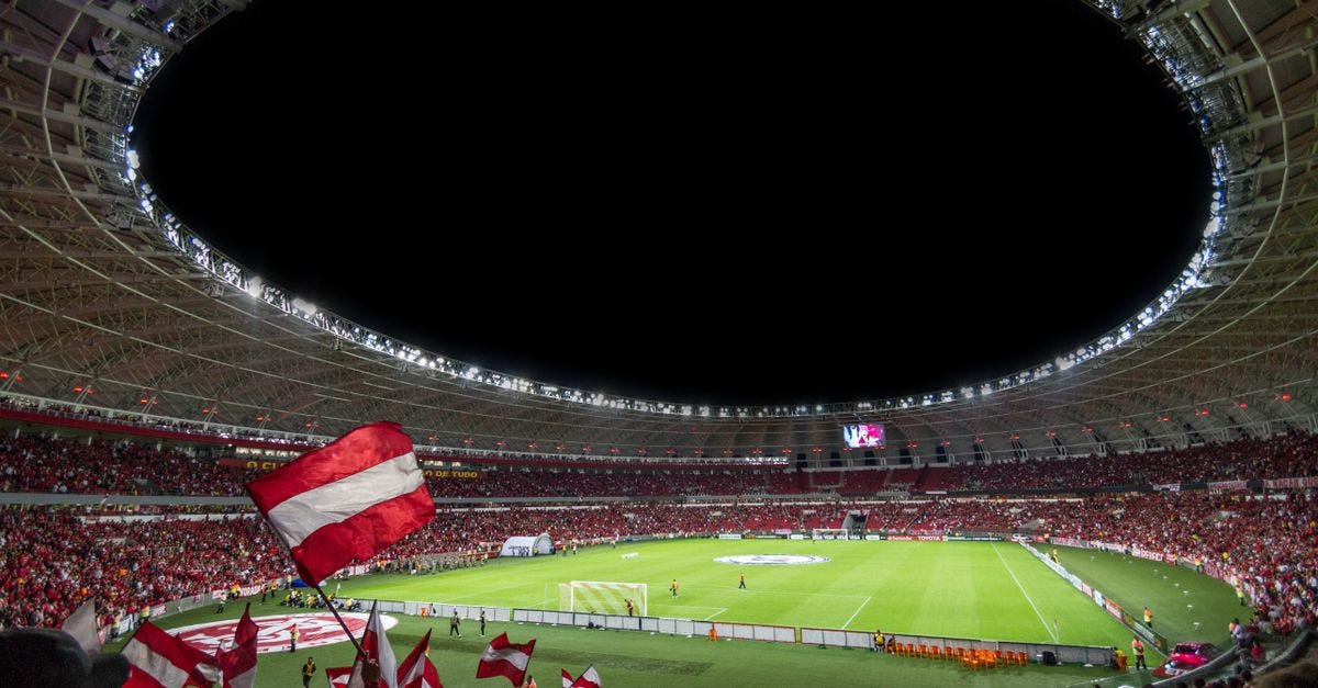 Photo: Riccardo / Pexels Exciting soccer match with enthusiastic fans in a packed stadium under bright lights.