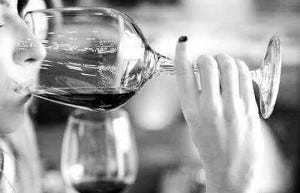 A wine lover takes a deep sniff.