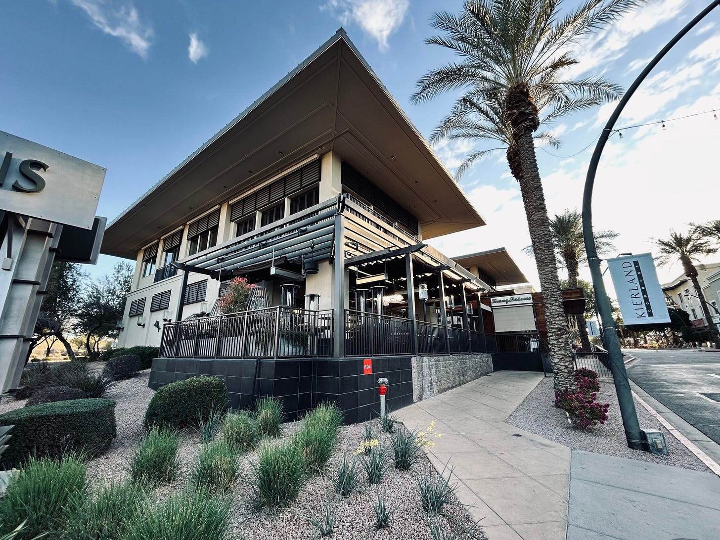building, palm trees, streets, sky