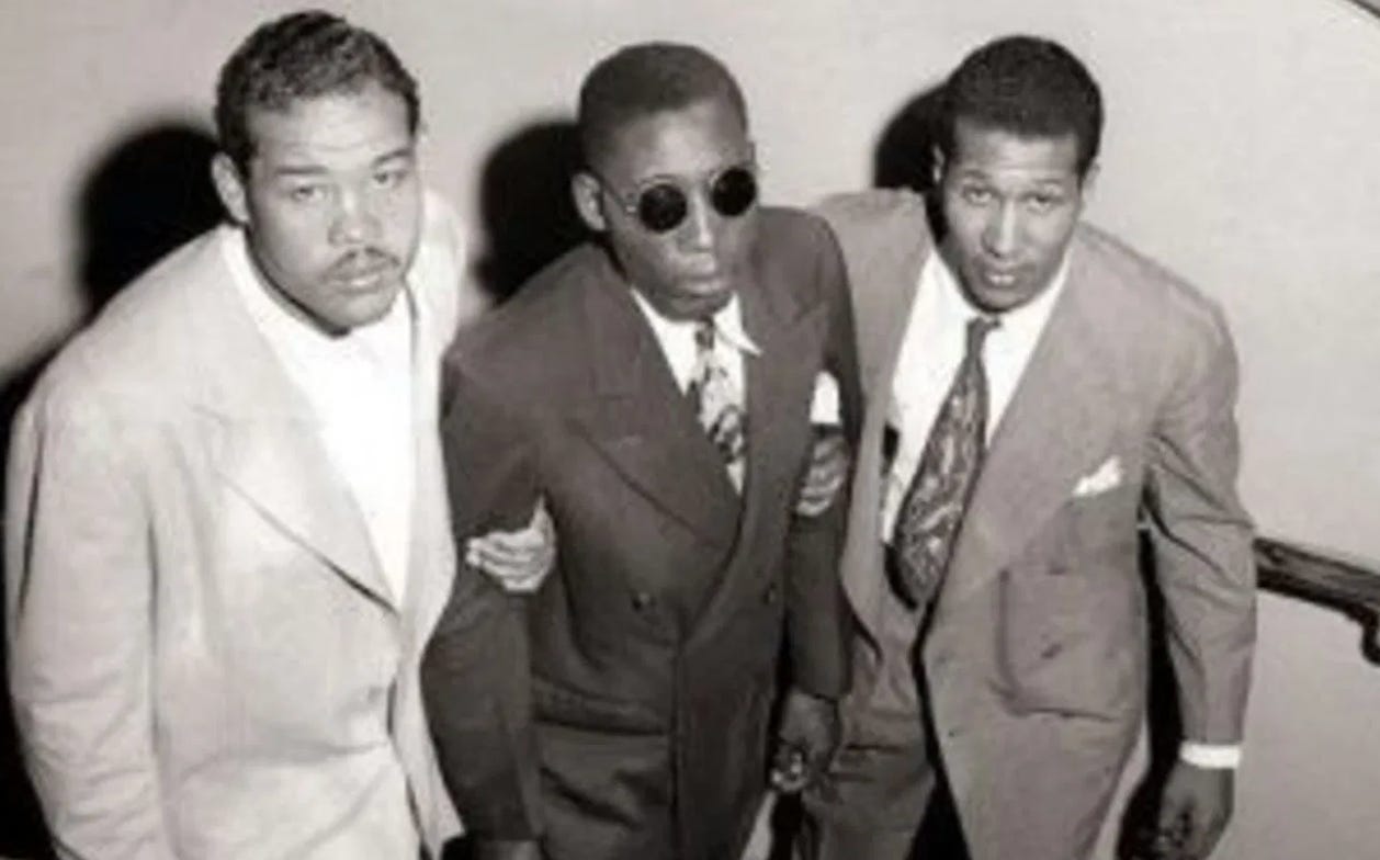 A group of men in suits

Description automatically generated