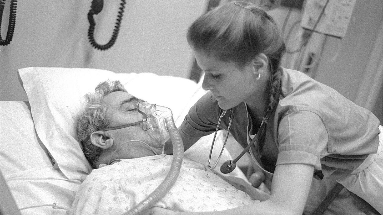 Near Death | Still features a woman observing a bedridden patient.