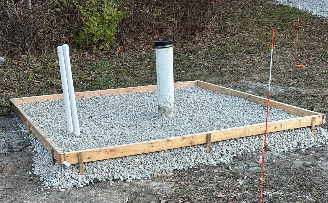 Frame for cement floor of well house Frame for cement floor of well house