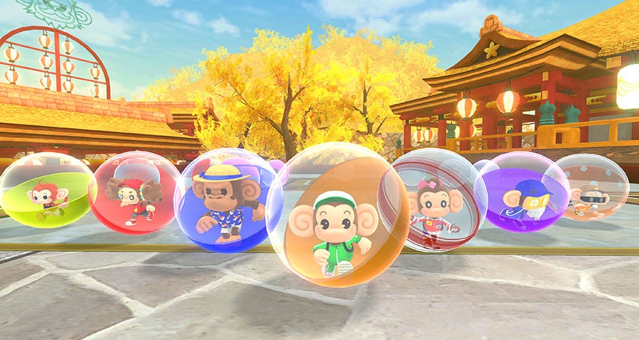Seven monkeys in plastic spheres lined up horizontally