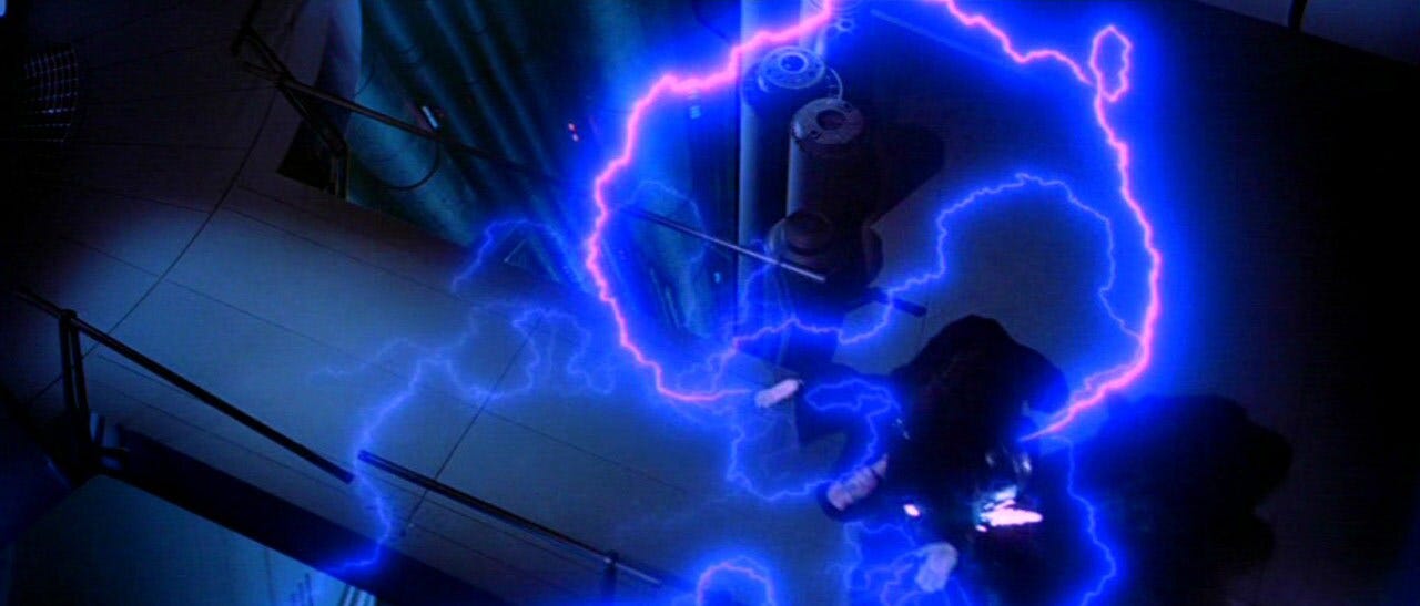 Vader watches the Emperor's attack on Luke. With great effort, Vader charges his master and lifts the Emperor's body over his head, the lightning bolts coursing through both their bodies. In a final lunge, Vader throws the Emperor into a deep reactor shaft, killing him. Vader drops to the floor, laboring to breathe. 