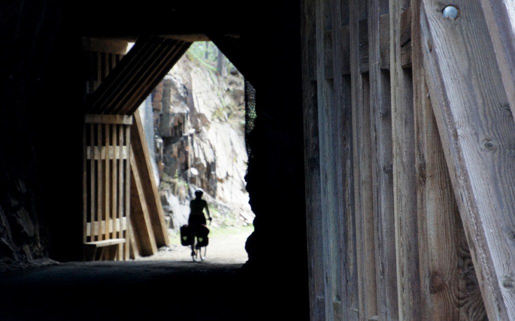 The trail cuts through a number of cool old tunnels from the railroad days. The trail cuts through a number of cool old tunnels from the railroad days.