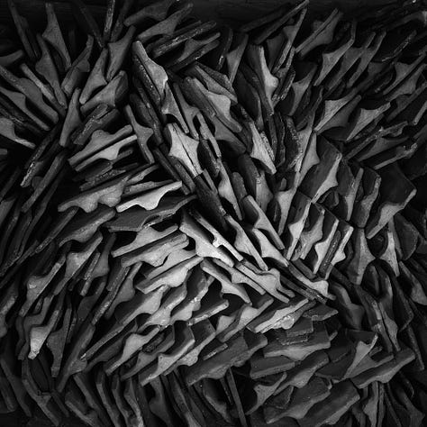 Six black and white square images that have caught my eye, left to right top row - a stack of chairs, a stack of roofing tiles, the open window in my room, an old tyre leaning against a tree with flwoers growing around it, the door of an old wooden barn and a pipe with a curve to a tap