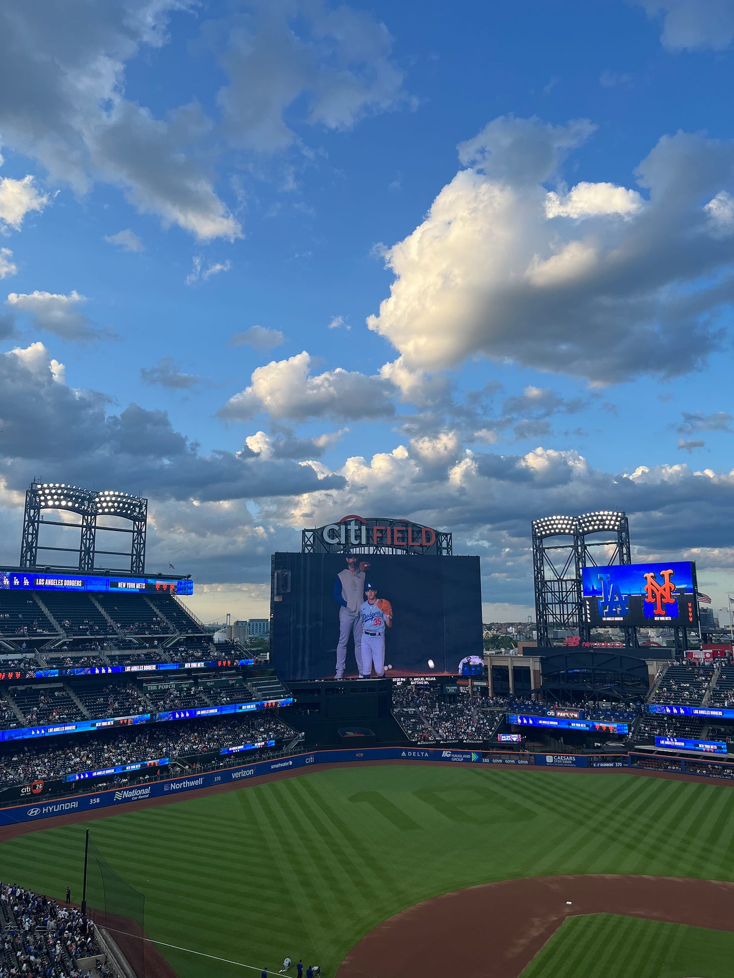 Citi Field baseball stadium with a blue, cloudy sky above. Citi Field baseball stadium with a blue, cloudy sky above.