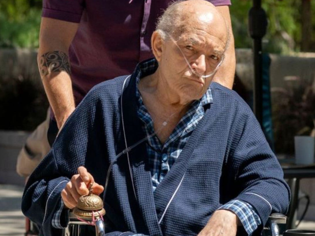 A person in a wheelchair

Description automatically generated