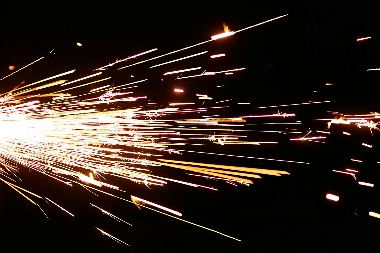 Electric sparks shooting accross a black background. Electric sparks shooting accross a black background.