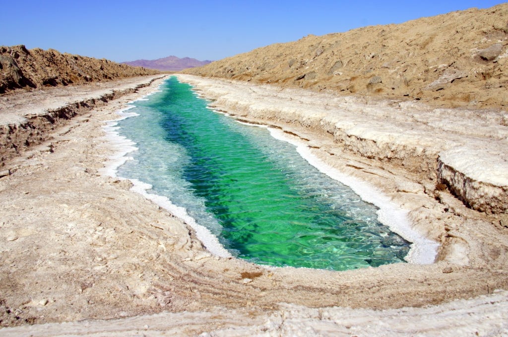 Caribbean-green salt mine in the middle of the Mojave. Caribbean-green salt mine in the middle of the Mojave.