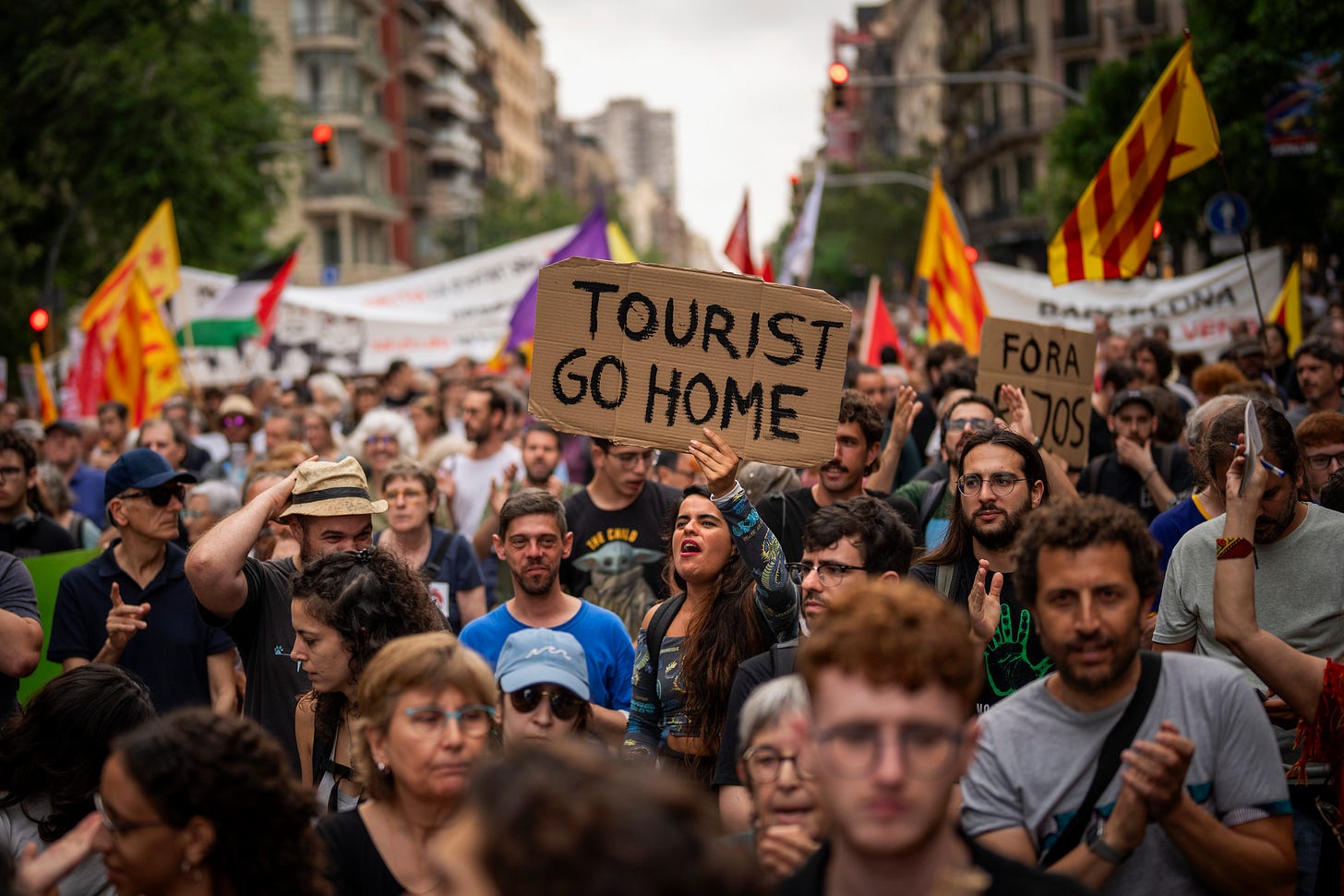 Demonstrators march shouting slogans against the Formula 1 Barcelona Fan Festival in downtown Barcelona, Spain on June 19, 2024, during residents protest against mass tourism. (AP Photo/Emilio Morenatti, File).