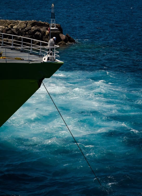 Person Standing in Boat