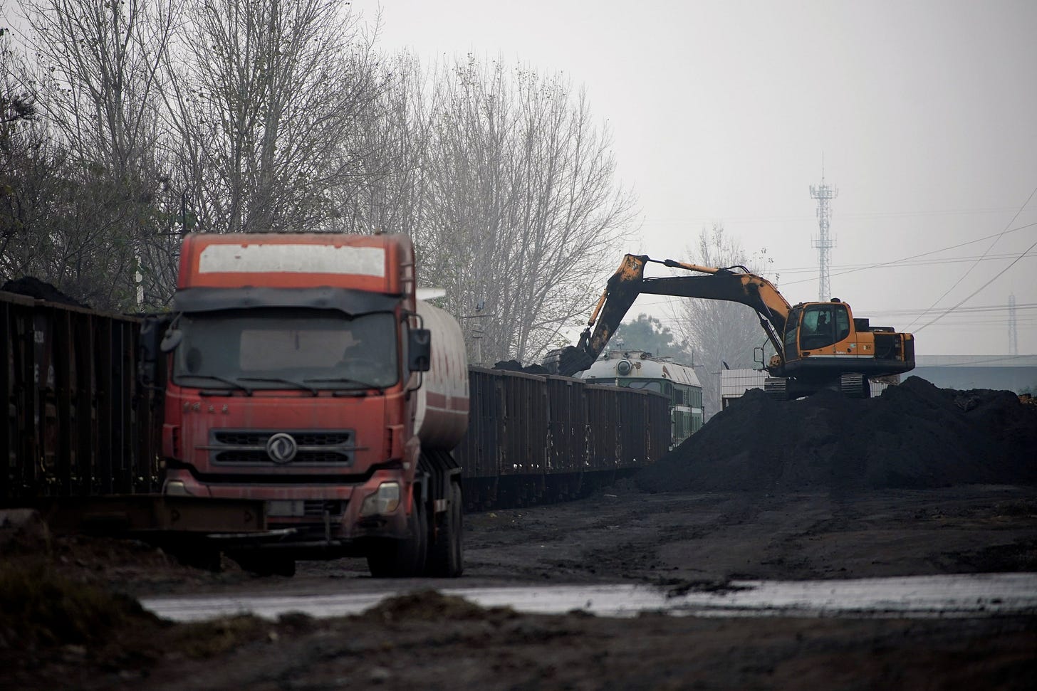 Excavator loads coal to a train in Pingdingshan