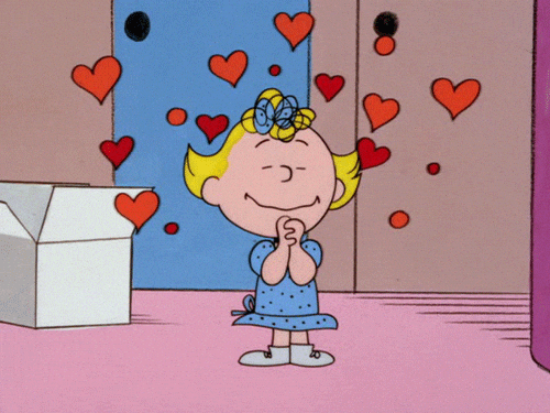 Gif animé de Sally Brown entourée de coeurs.