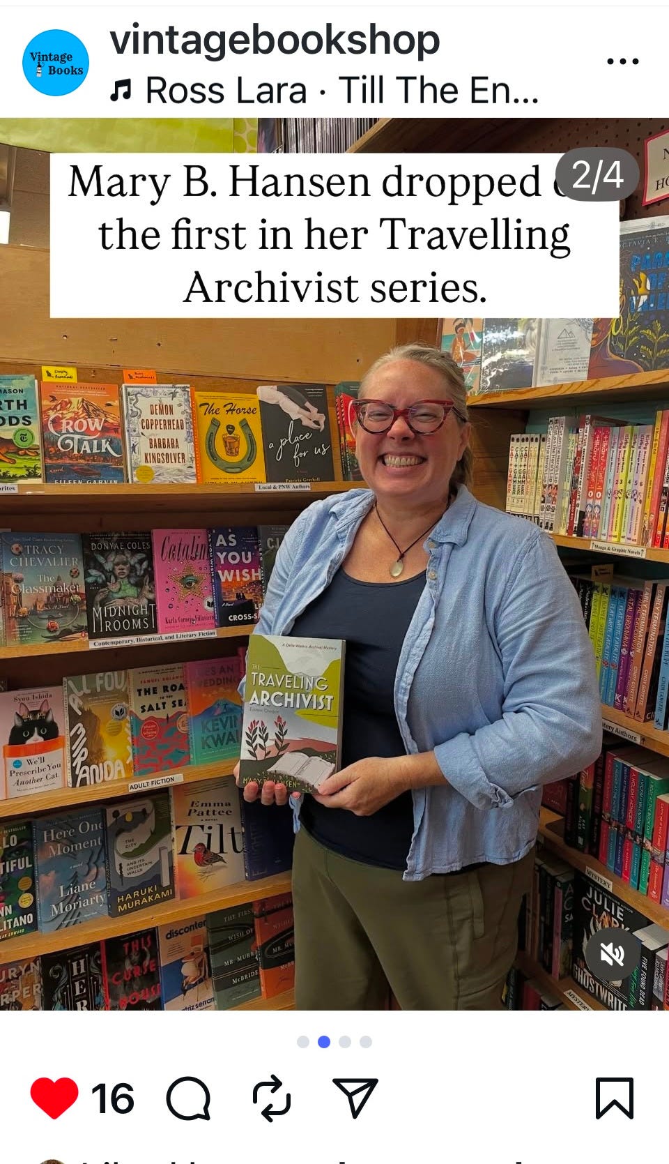 Woman holding book in front of bookshelves Woman holding book in front of bookshelves