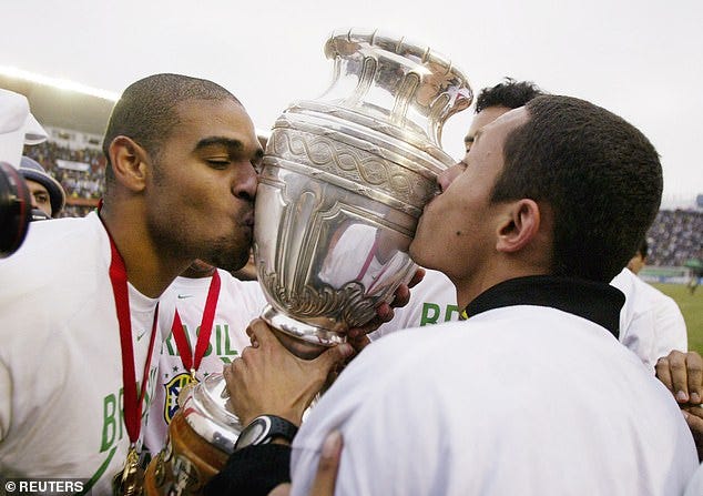 Brazilian Adriano (L) and Adriano Correia kiss the trophy after winning the Copa America final match against Argentina in Lima, July 25, 2004. Brazil won the match 4-2 in a penalty shootout after the match ended in a tie Brazilian Adriano (L) and Adriano Correia kiss the trophy after winning the Copa America final match against Argentina in Lima, July 25, 2004. Brazil won the match 4-2 in a penalty shootout after the match ended in a tie