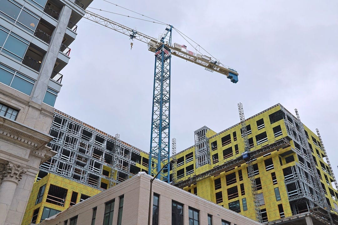 a crane that is on top of a building