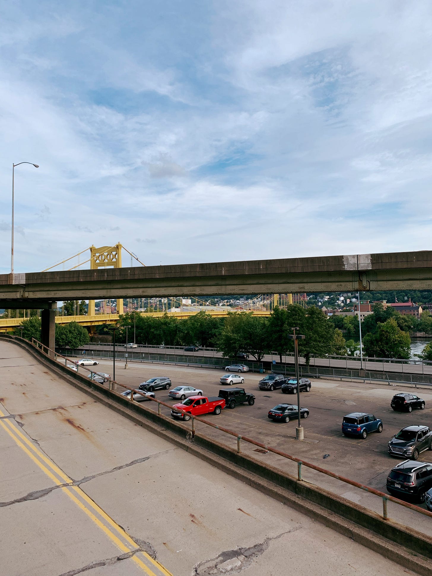 Looking at a highway in front of yellow bridge