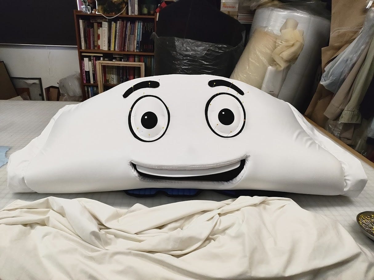 Protein Pete costume is deflated on the floor