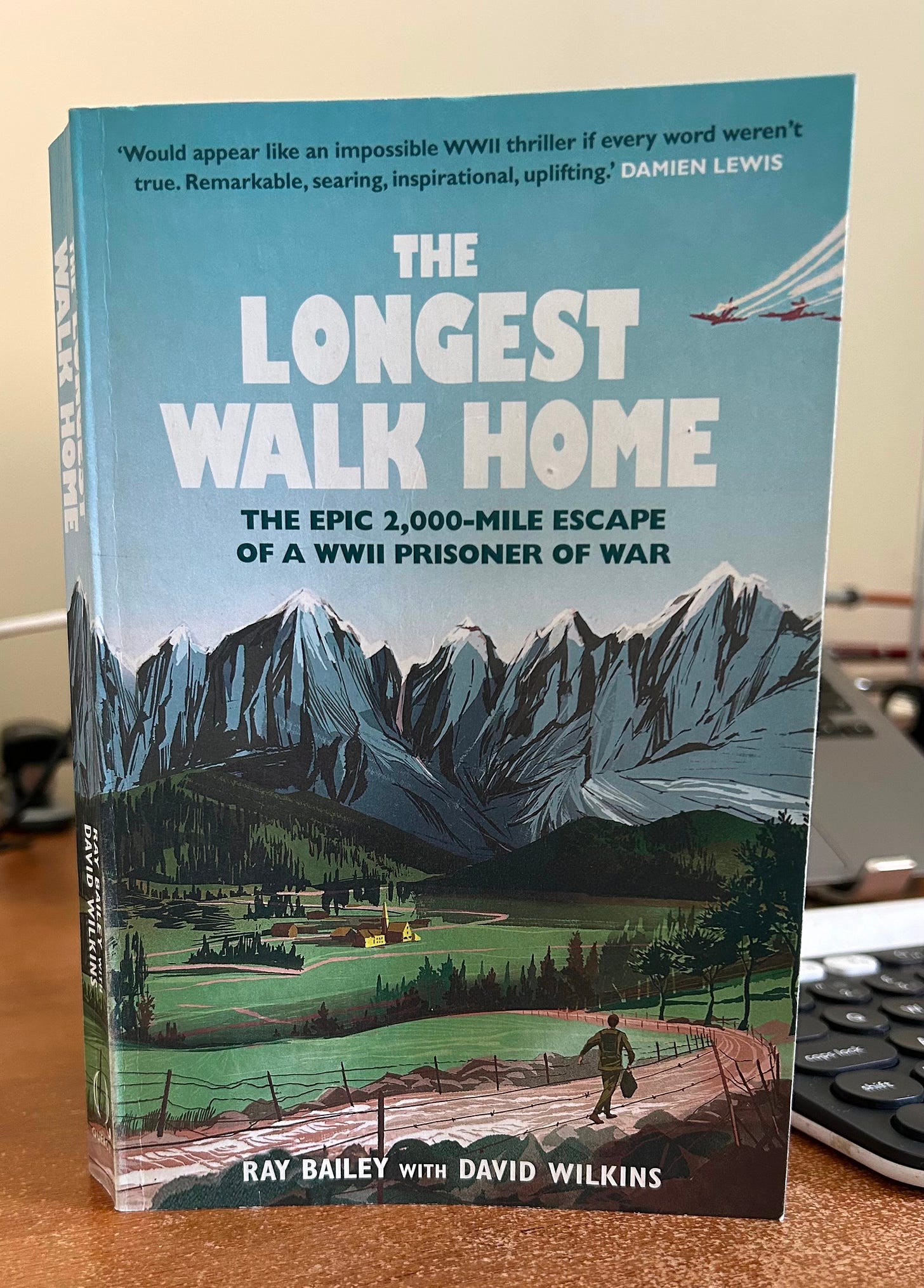 A book stands on a desk. It is The Longest Walk Home by Ray Bailey with David Wilkins. A book stands on a desk. It is The Longest Walk Home by Ray Bailey with David Wilkins.