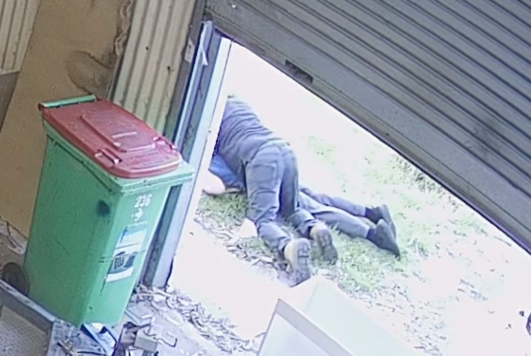 Man lying on top of fake seizure guy