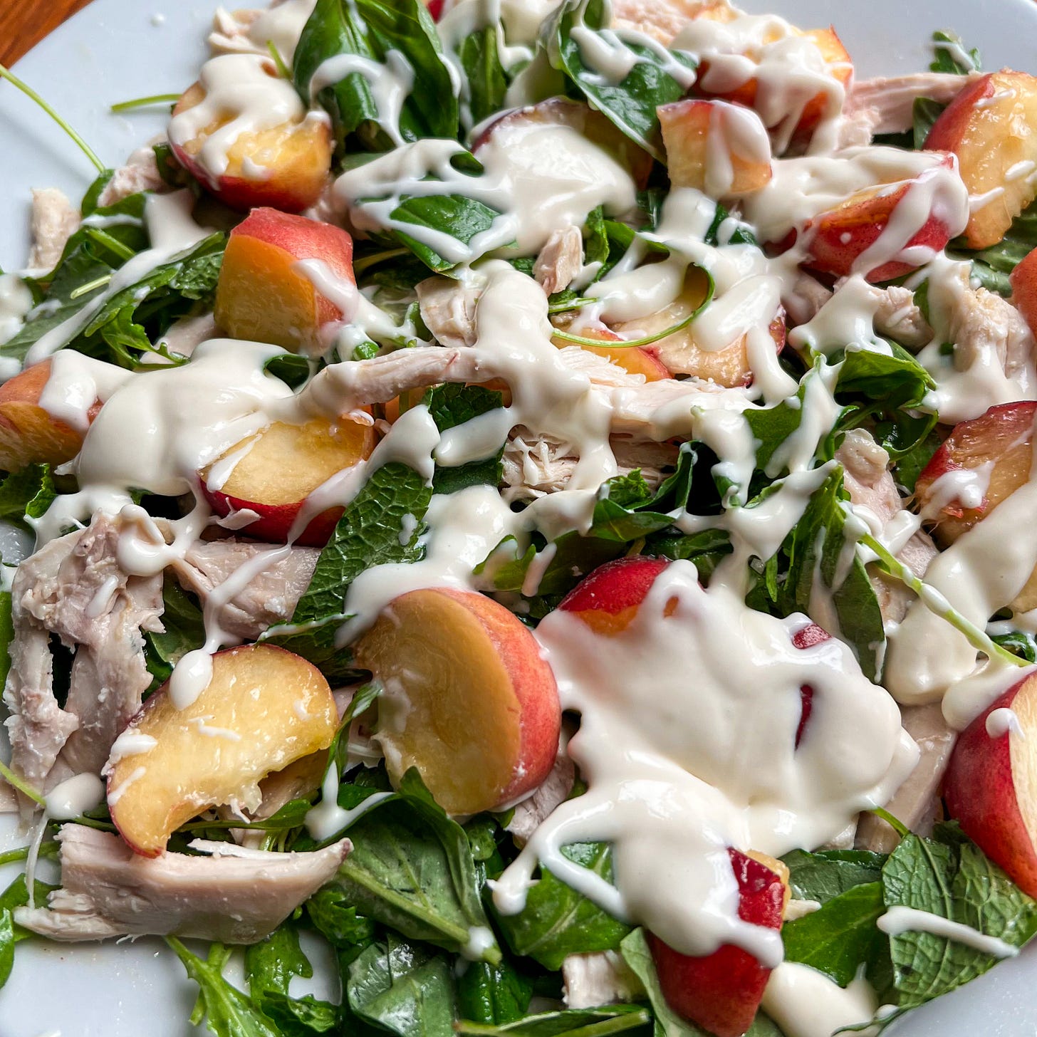 a salad as described in the paragraph above on a white plate