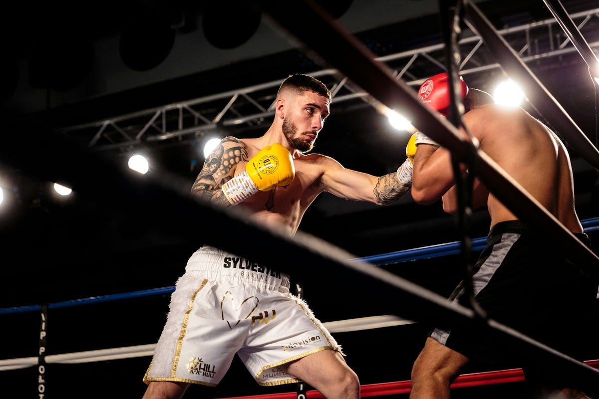 Boxers in the ring fighting. Boxers in the ring fighting.