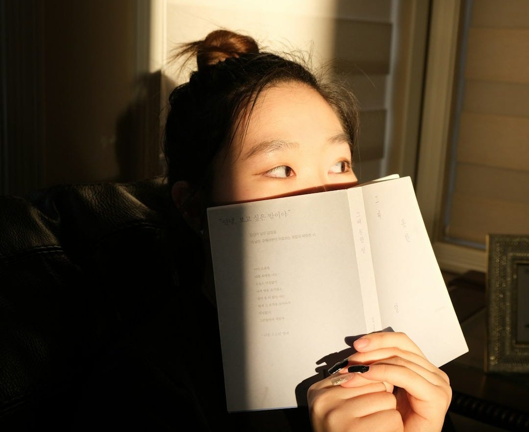 woman holding white printer paper woman holding white printer paper