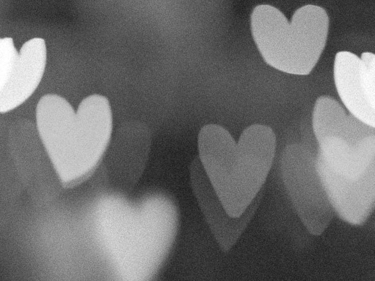 This may contain: blurry image of hearts in the background This may contain: blurry image of hearts in the background