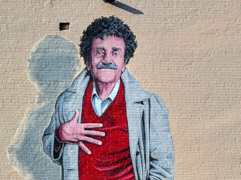 A painting of a man with a red shirt and black pants A painting of a man with a red shirt and black pants
