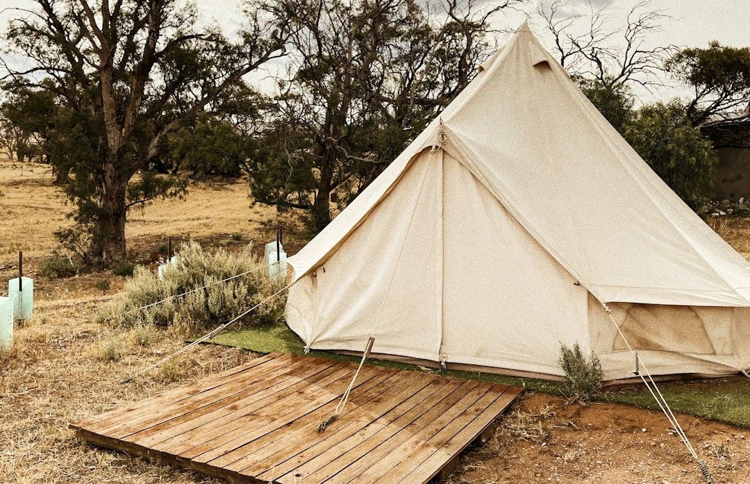 white tent on brown soil