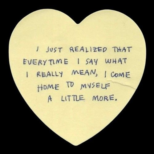 This may contain: a white heart with writing on it that says i just related that everytime i say what i really mean, come home to myself a little more