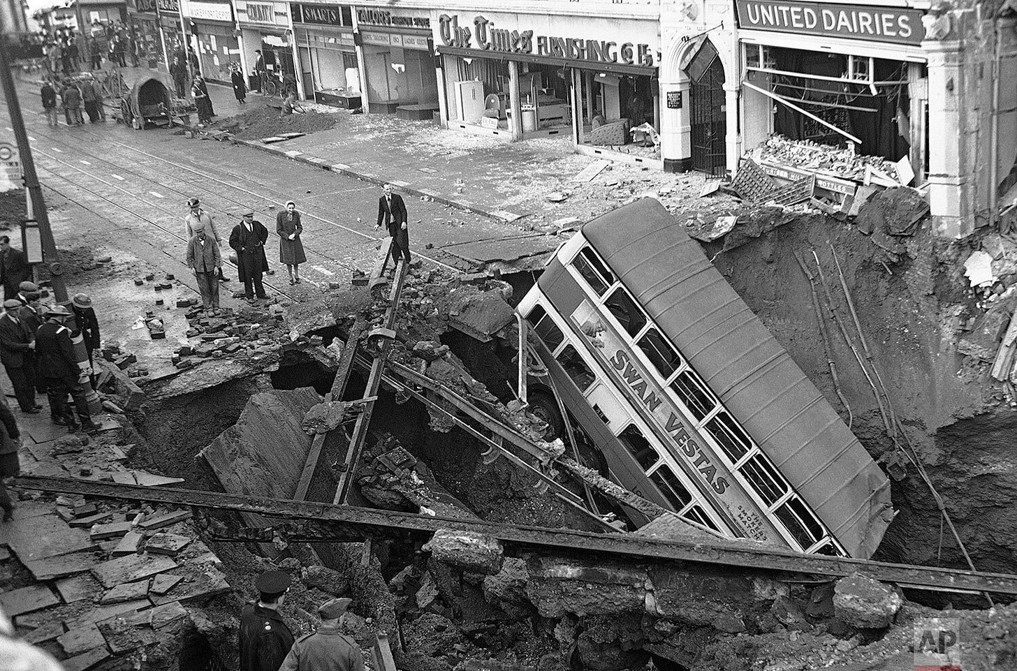 A London bus, precariously standing on end in a massive bomb crater on Oct. 15, 1940, illustrates the surreal destruction left in the wake of a Nazi air raid during the Blitz. A London bus, precariously standing on end in a massive bomb crater on Oct. 15, 1940, illustrates the surreal destruction left in the wake of a Nazi air raid during the Blitz.