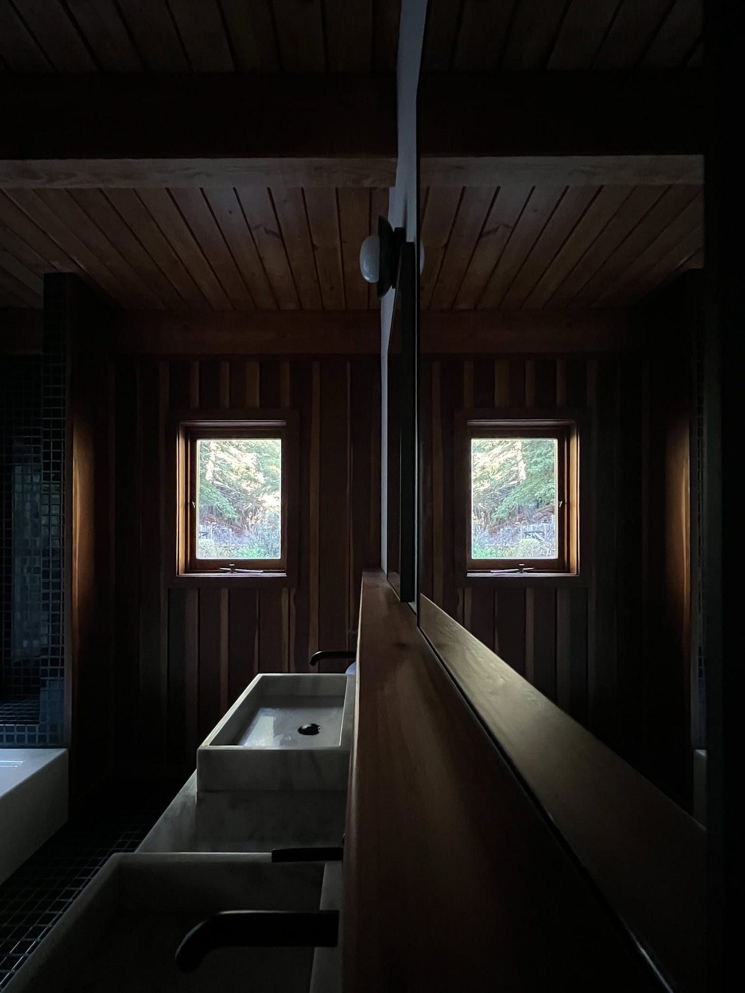 a look at the cabin bath floating shelf and the two new mirrors with the picture window reflecting back.