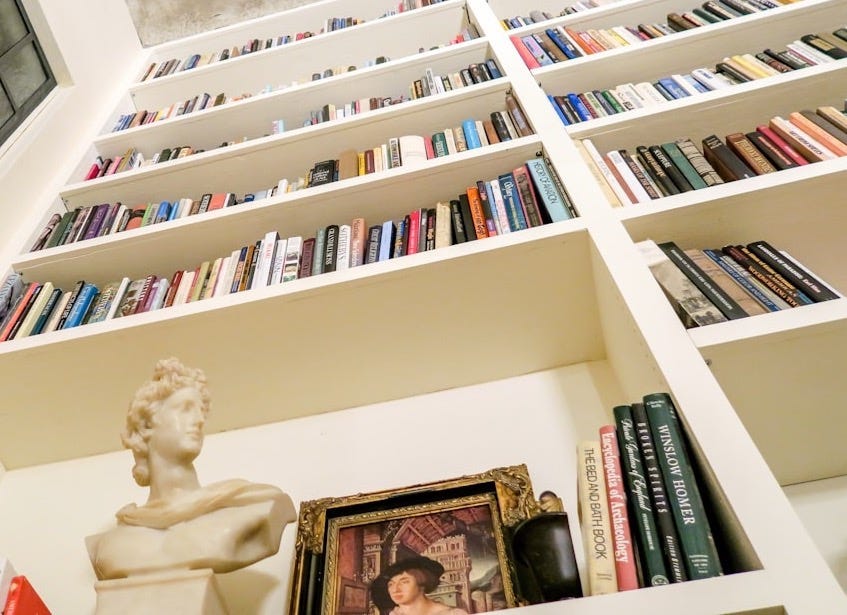 low angle photo of assorted book on bookshelf