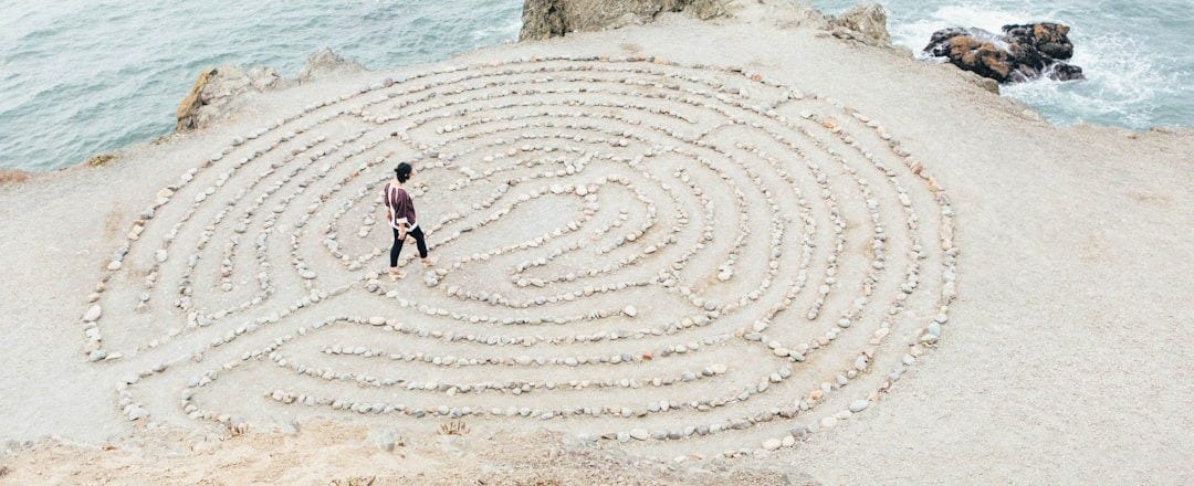 person walking on beach during daytime