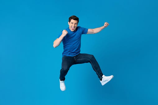 American man jumping and enyoying his success