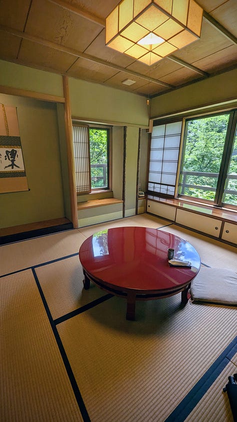 Japanese-style rooms, bowls of food, and bottles of sake.