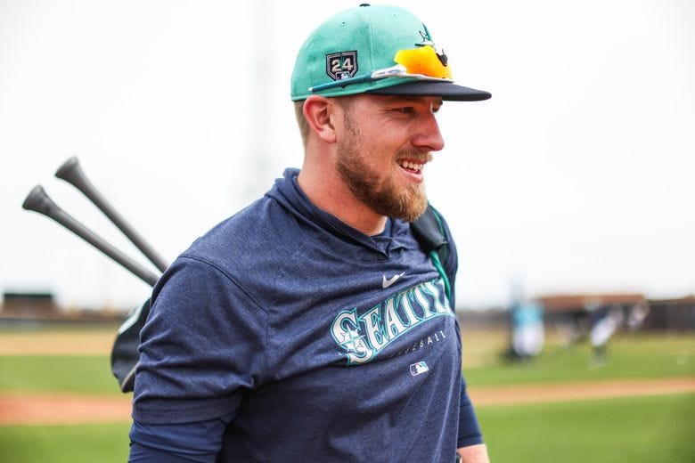 Luke Raley has been making adjustments to his swing. (Dean Rutz / The Seattle Times)