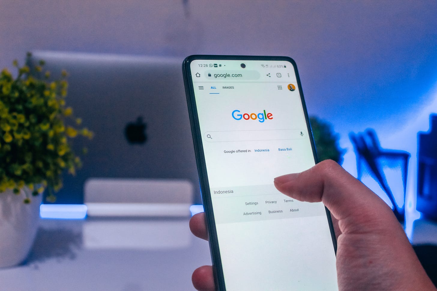 Phone displaying the Google homepage Phone displaying the Google homepage