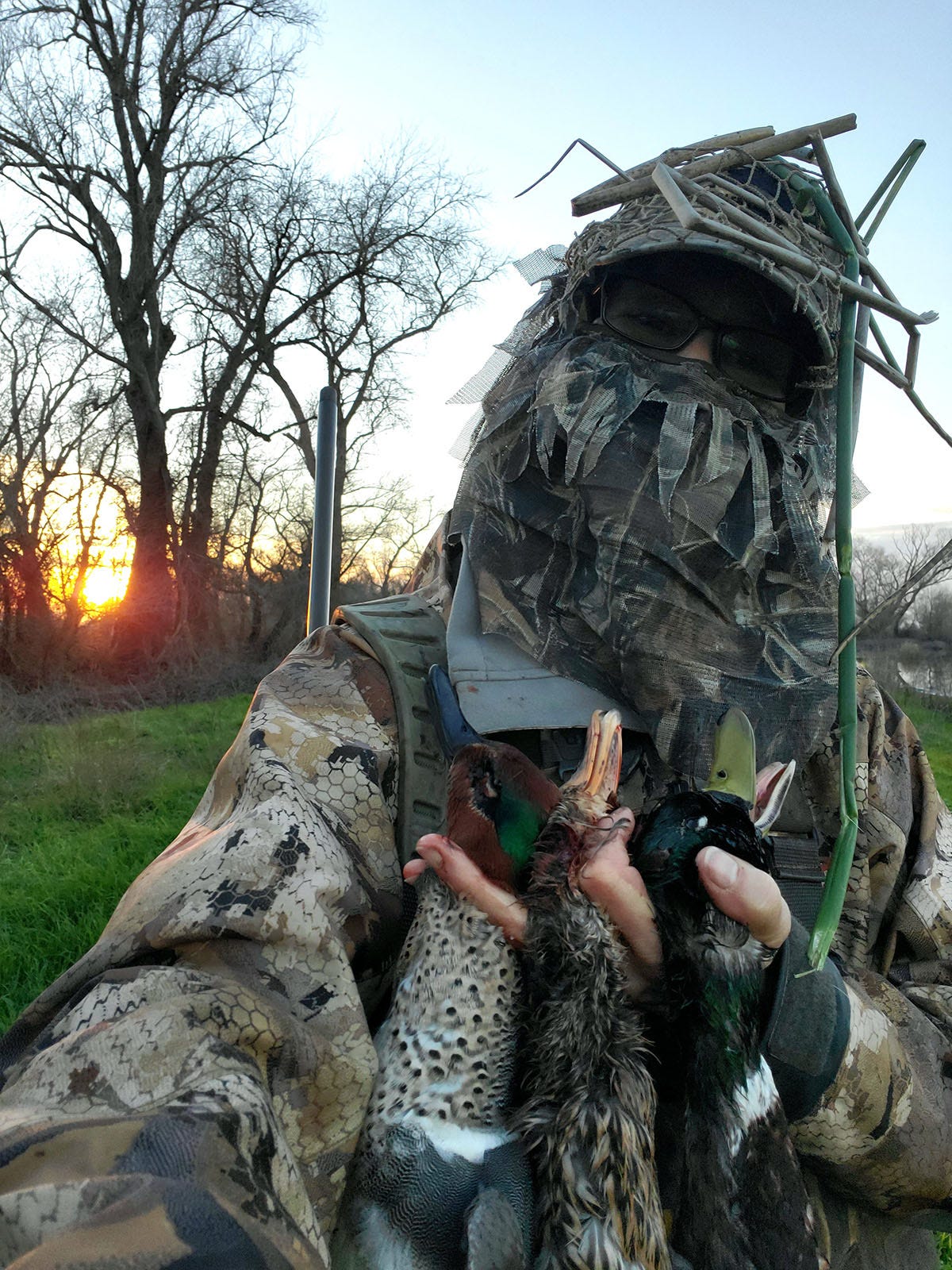 Woman in camo with ducks Woman in camo with ducks