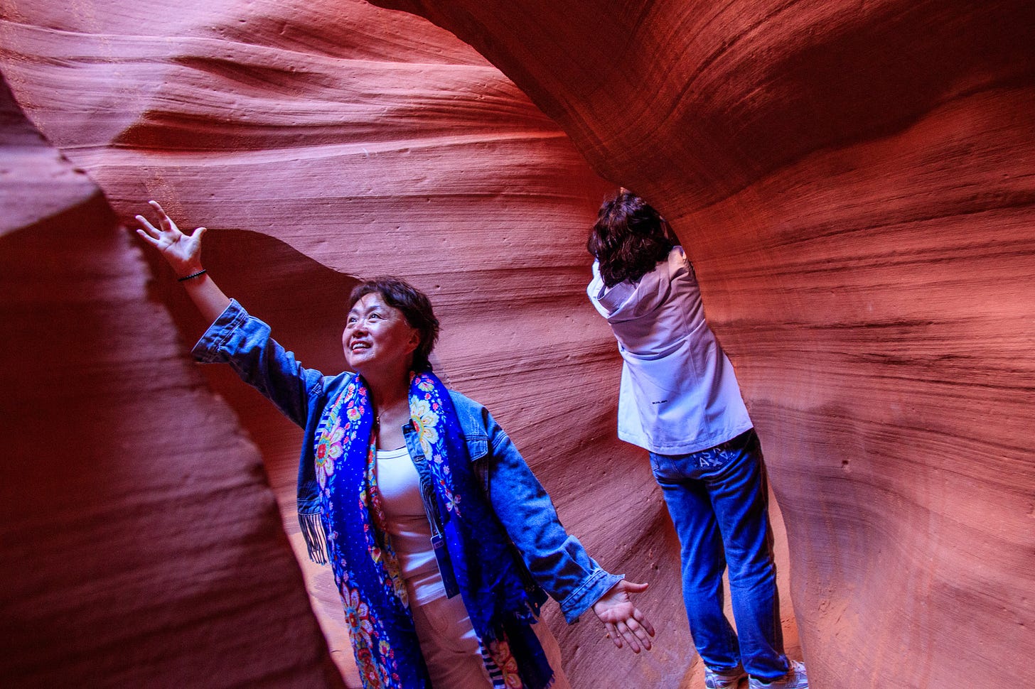 Chinese tourist posing for a picture inside lower Antelope Canyon Chinese tourist posing for a picture inside lower Antelope Canyon