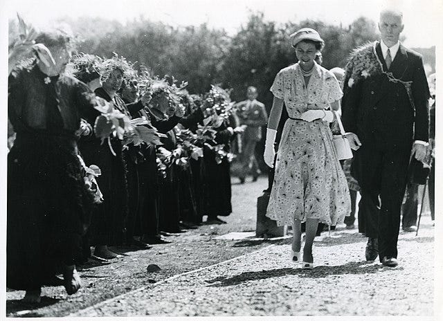 Queen Elizabeth and King Phillip walking