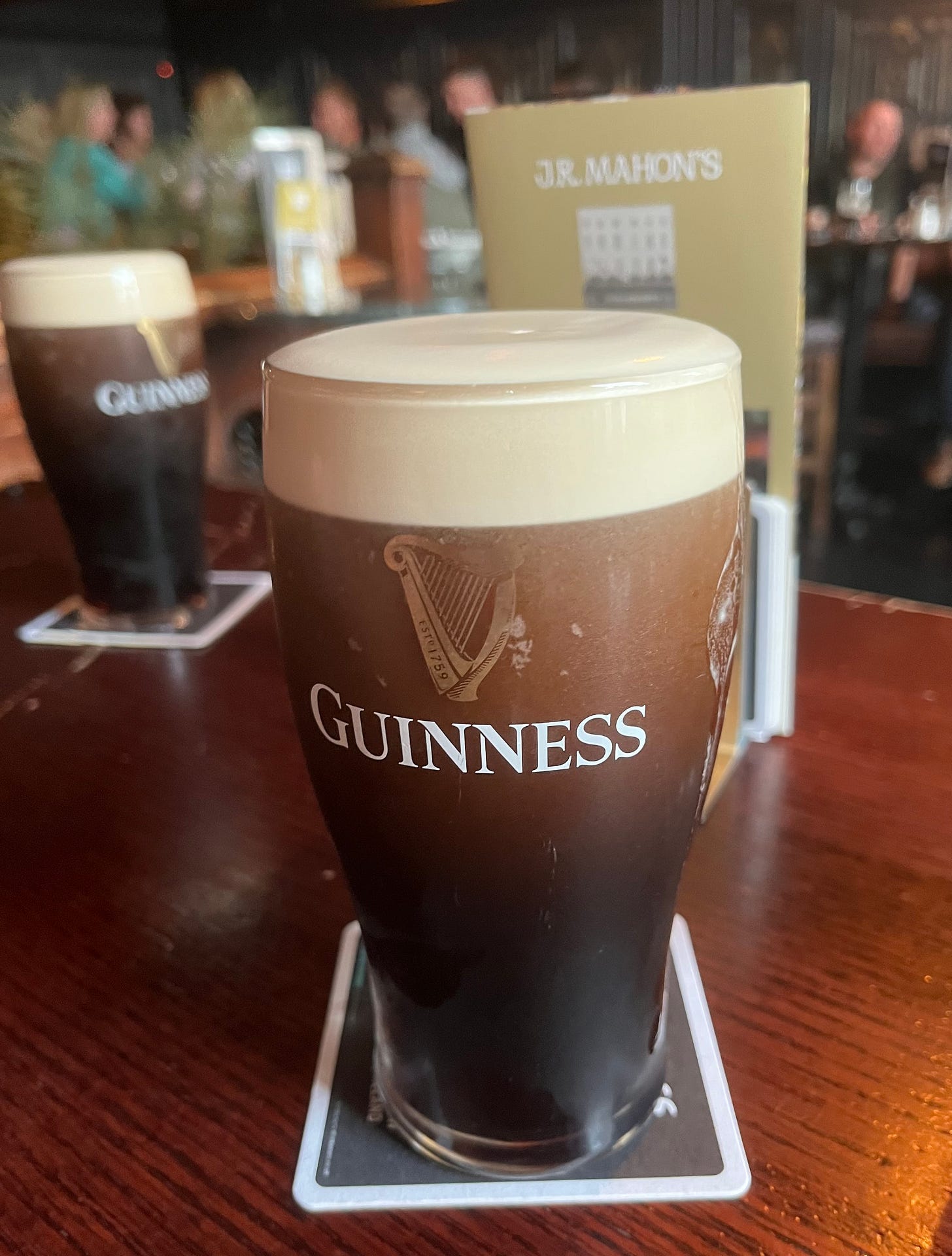 A glass of beer on a table

Description automatically generated